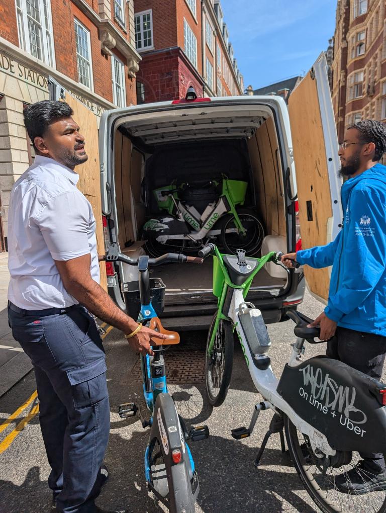 Officers remove an ebike from obstructing the street