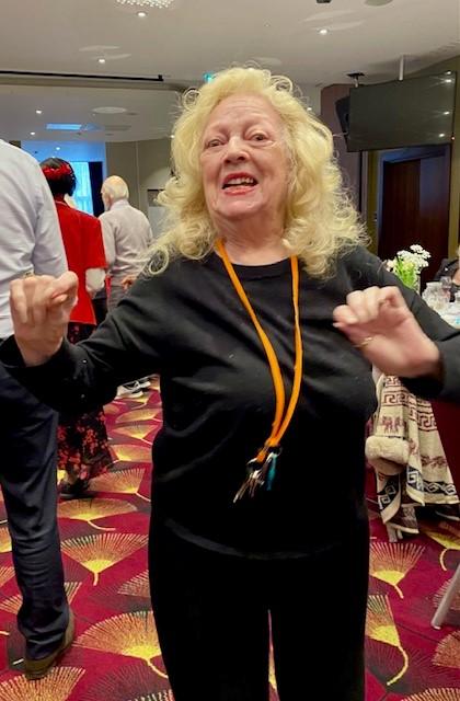 A woman dancing at a luncheon event