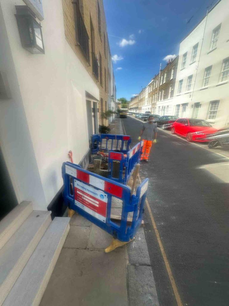 Image of a man carrying out works on the pavement