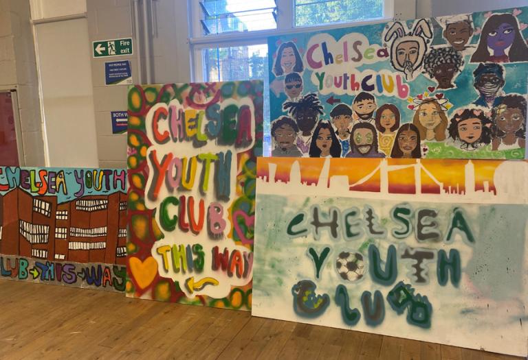 Art work completed in Sophie Macdonald’s community art classes at the Harrow Club that sign posts to Chelsea Youth Club