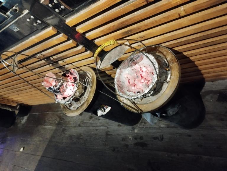 Shisha hanged on wooden fencing