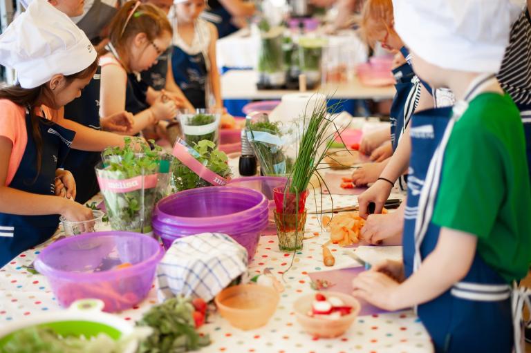 Children cooking and eating