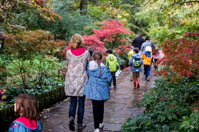 Children walking down park path.