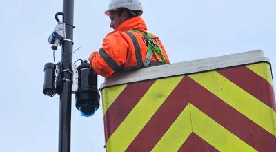 Man installing a new CCTV camera