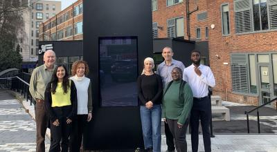 A group of people standing outside a building