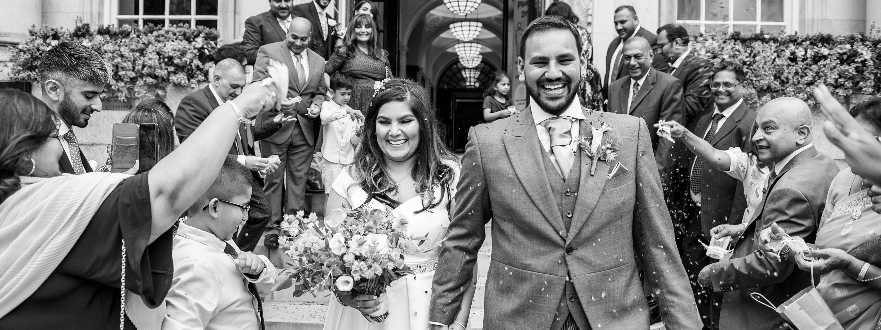 Just married couple leaving venue