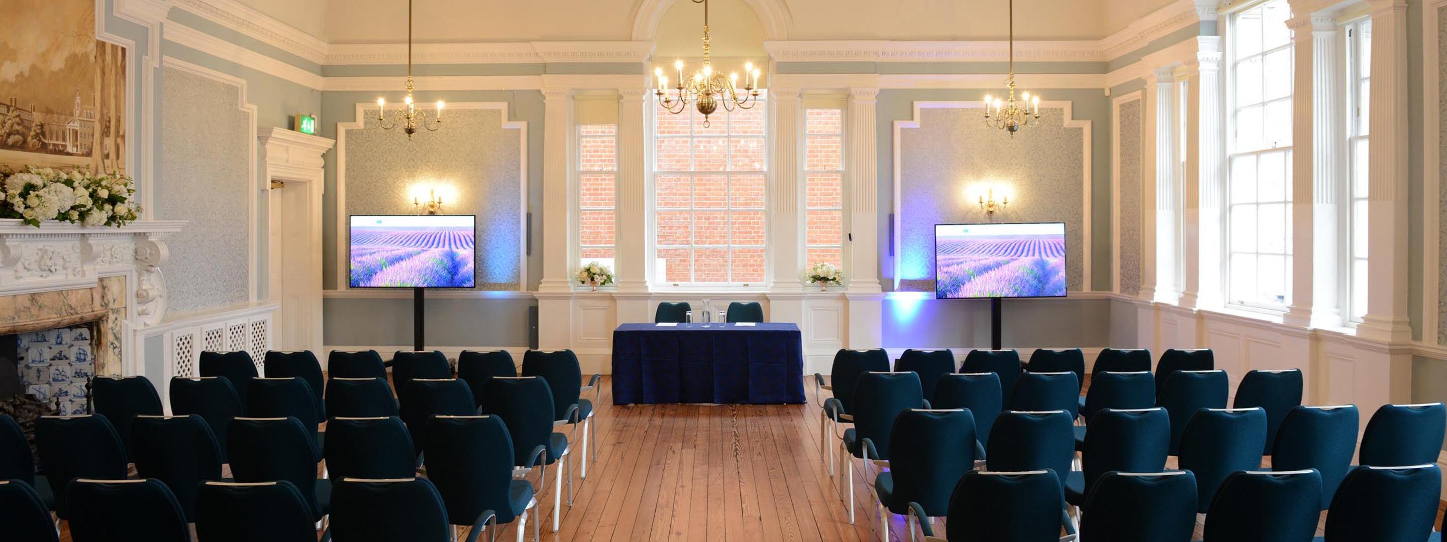 Cadogan suite ceremony conference layout with blue chairs
