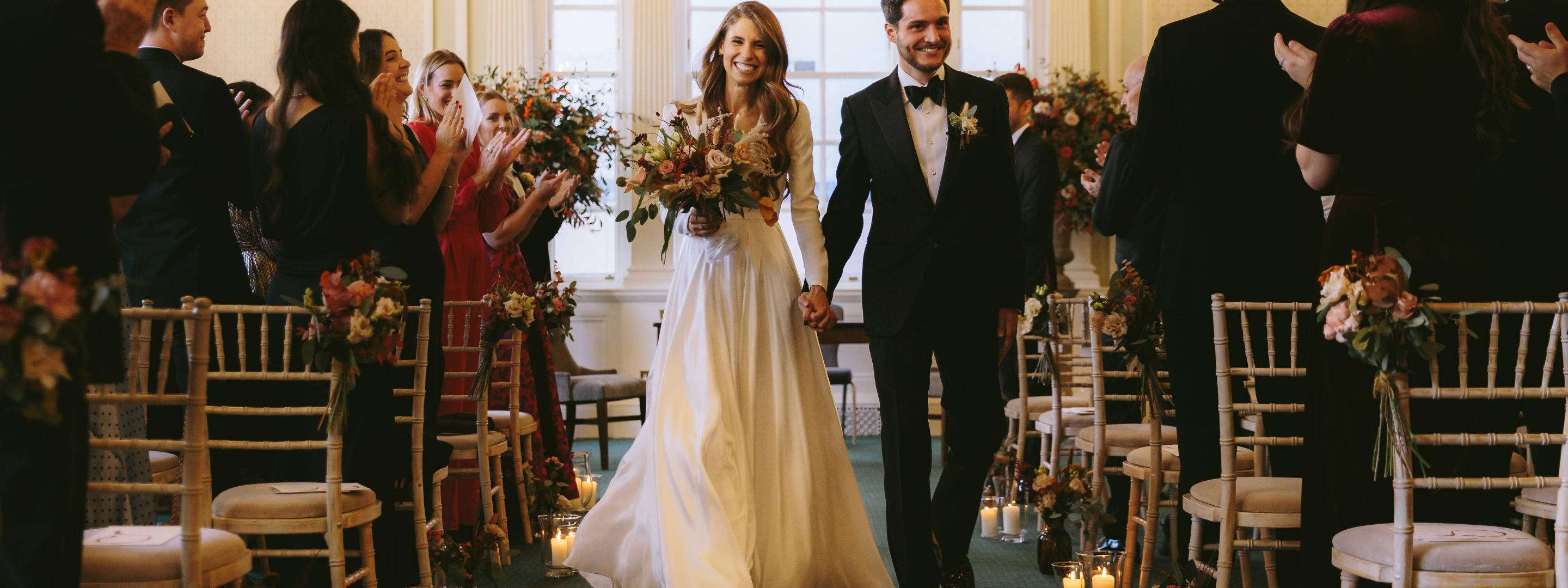 Married couple walking down the aisle