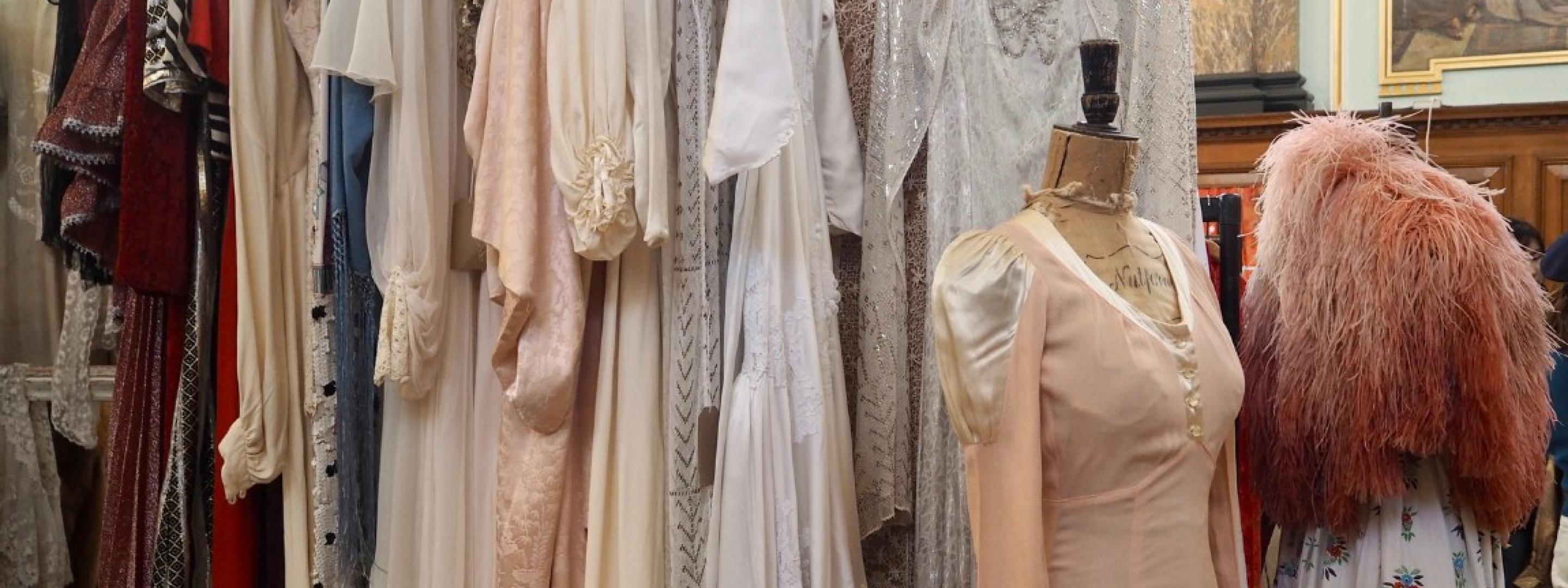 A selection of vintage dresses on a clothes rail