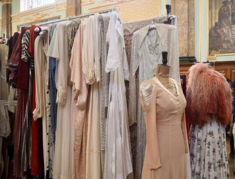 A selection of vintage dresses on a clothes rail